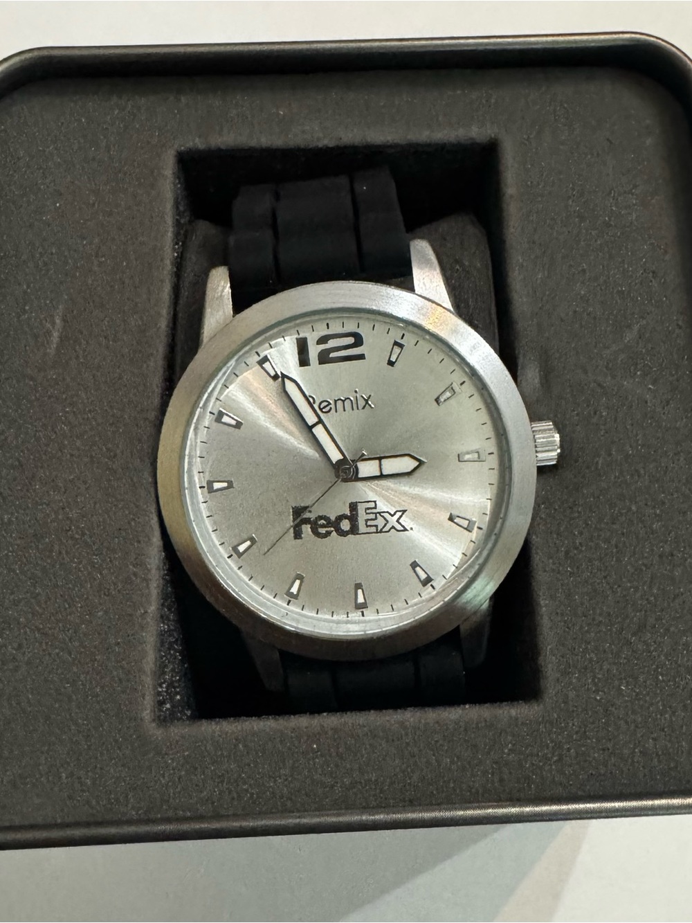 A Remix FedEx promotional analog quartz wrist watch.